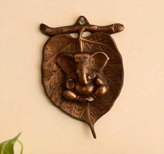 eCraftIndia Metal wall hanging of Lord Ganesha on Leaf